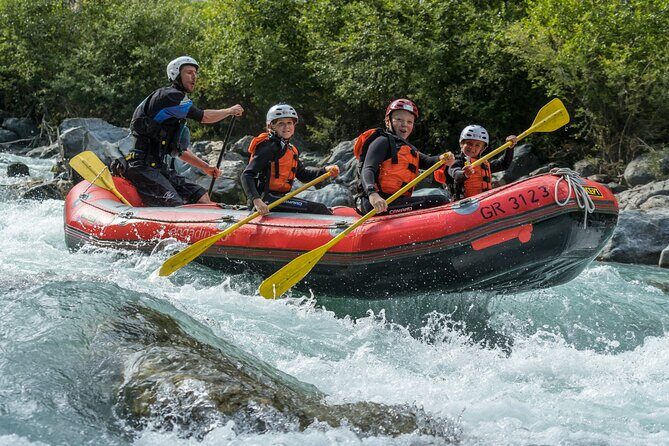 Family Rafting Experience in Engadin - Getting ready for cold water: neoprene suits, briefing, and real control