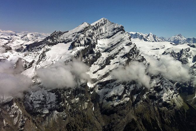 Private Swiss Alps helicopter tour over snow covered mountain peaks and glaciers - Eiger North Face: When Snow Makes a Vertical Wall Look Impossible