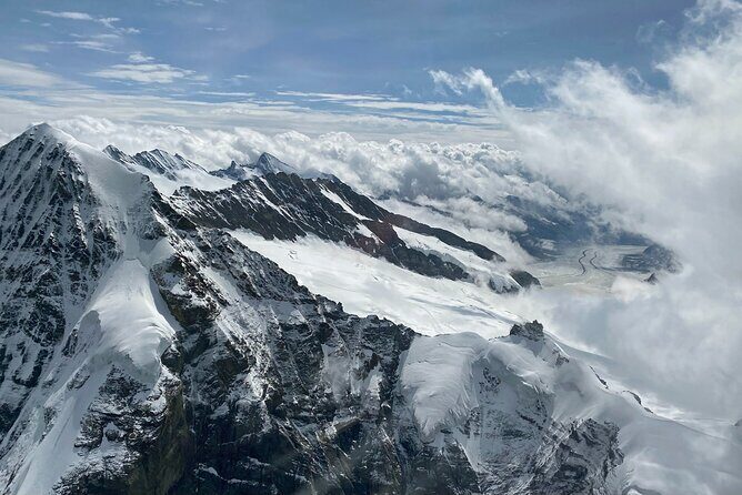 Private Swiss Alps helicopter tour over snow covered mountain peaks and glaciers - Interlaken From Above: Lakes Thun and Brienz in One View