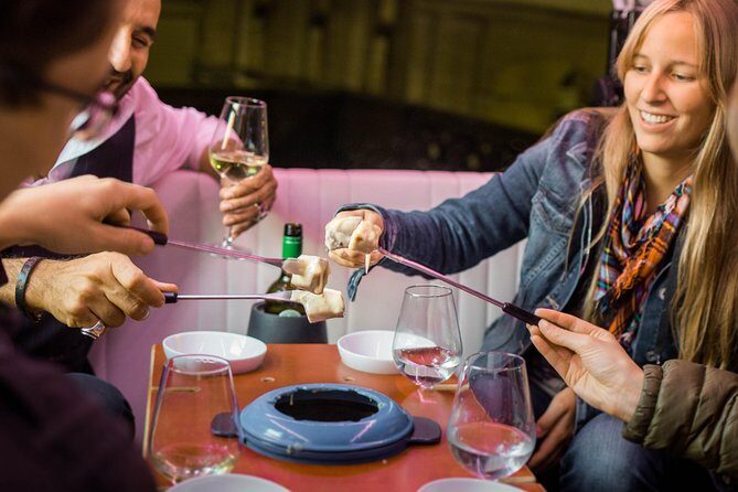 Zurich eTukTuk Private Tour - with Cheese Fondue and Wine - Bahnhofstrasse and the feeling of Zurich’s money street